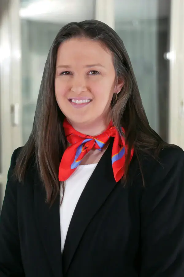 a woman wearing a red scarf around her neck